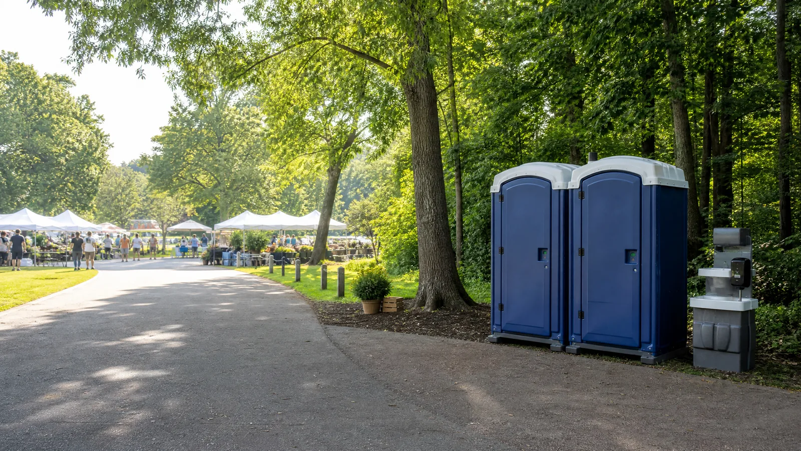 Clean portable restrooms positioned beside a community event walkway.